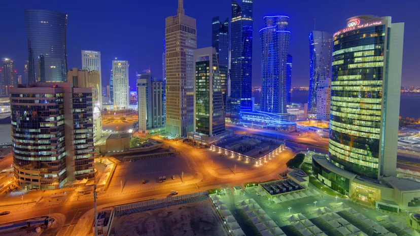 Office towers in the West Bay business district of Doha at dusk, seen from above