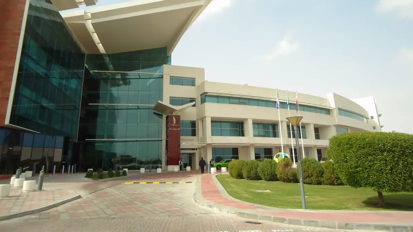 The Aspetar hospital building in Doha, a modern glass and white medical centre